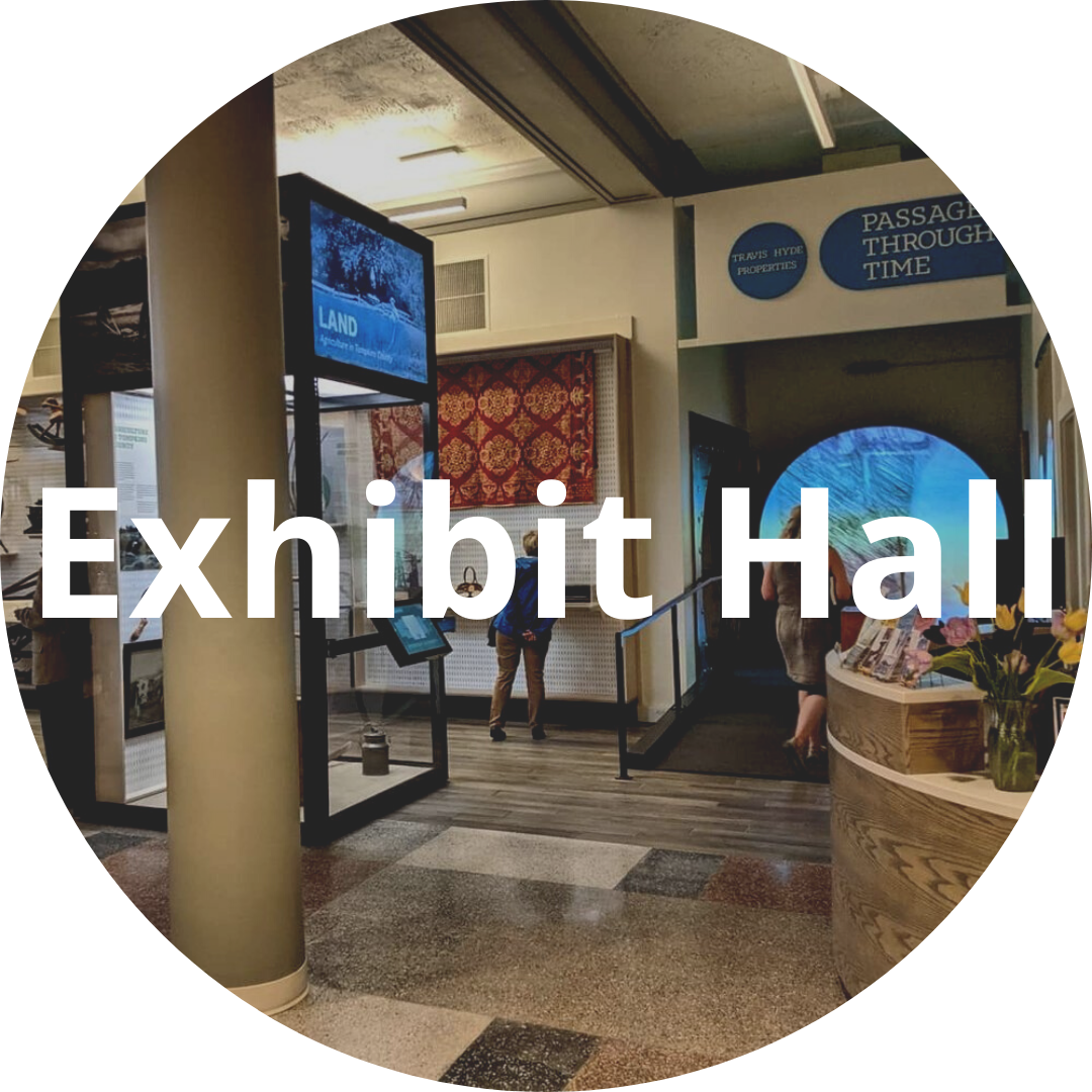 Circular image, text button "Exhibit Hall"