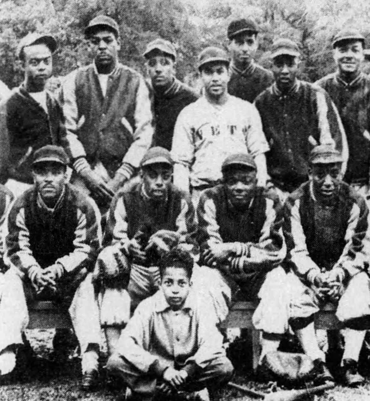 Image of the Ithaca's Colored Vets baseball team sometime in the 1940s. Players are arranged in 3 uneven rows.