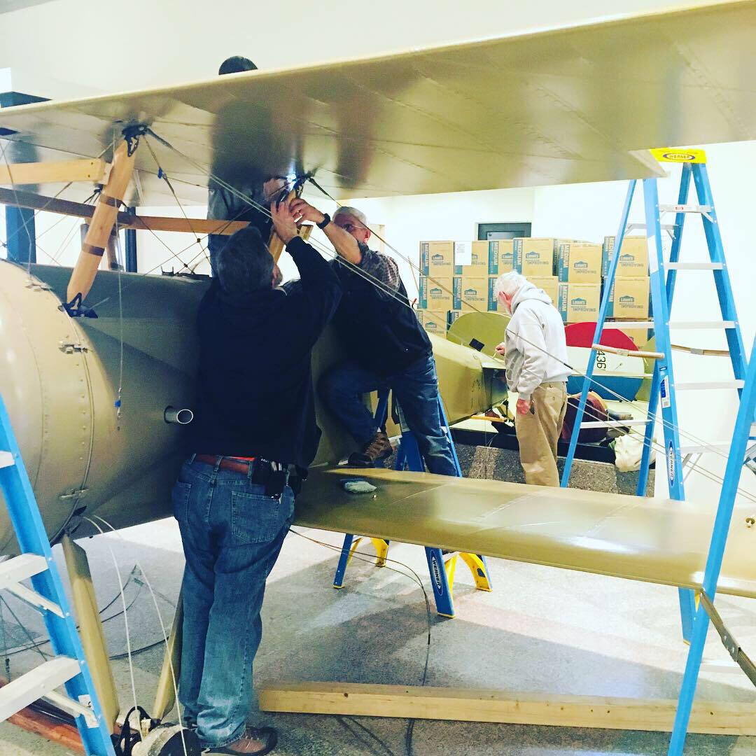 An image of people working on the Tommy Plane.